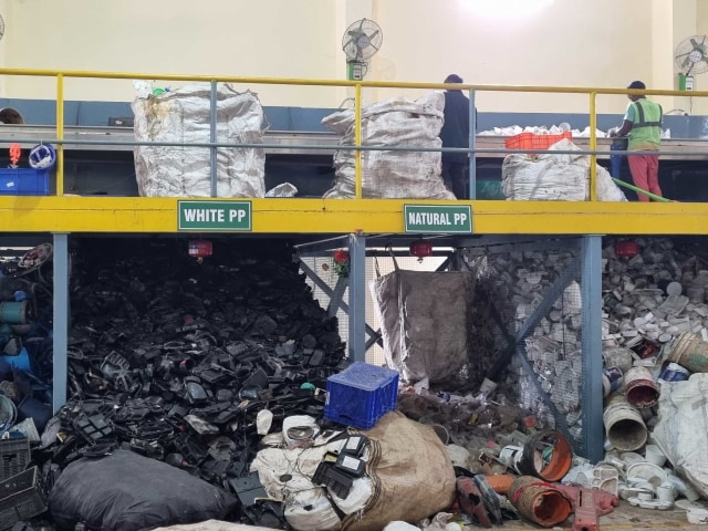 A plastic recovery facility in Bangalore helps waste workers sort plastics