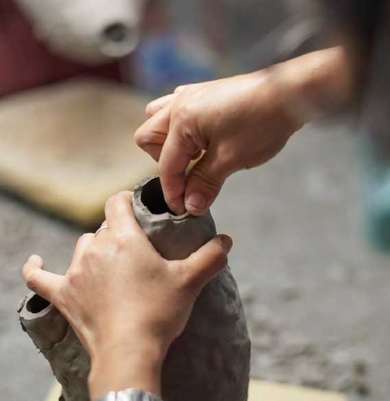 Hands clay vase