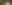 Mexican woman sitting in a field